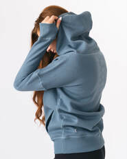 female model wearing ZYIA oh so soft blue hooded sweater